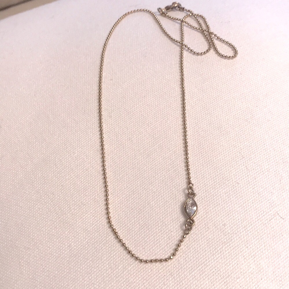 Anthropology necklace gold with marquise crystal.